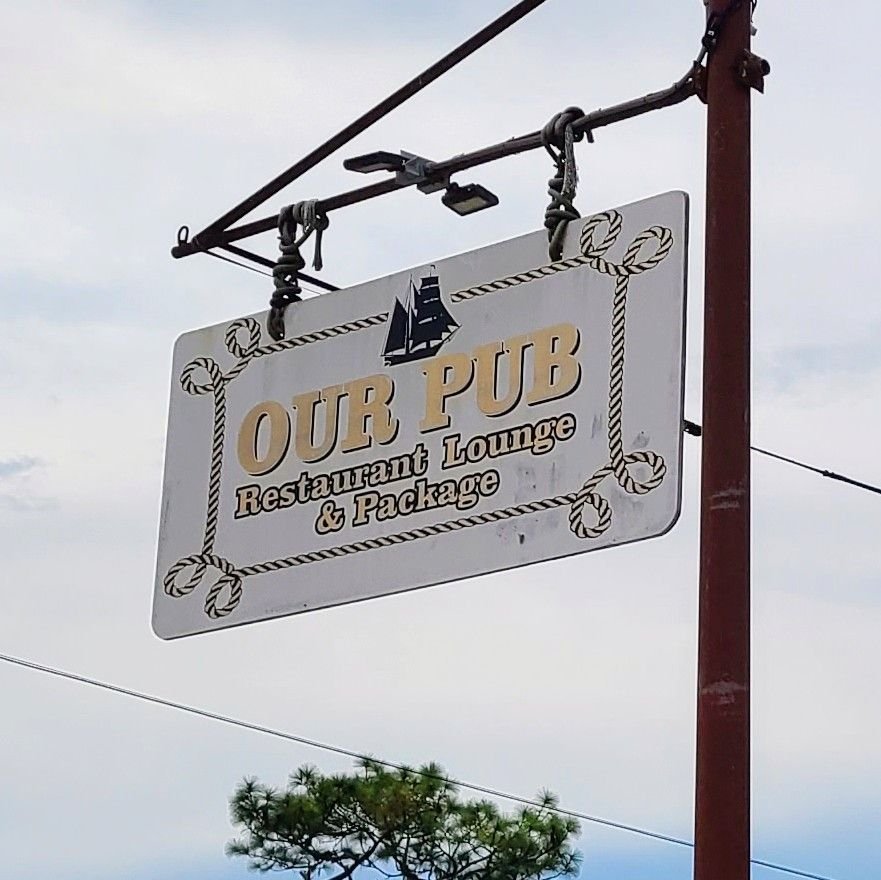 Signage of Our Pub, famed for the best pizza in Inglis, welcoming diners.
