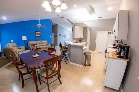 Spacious open-concept kitchen and living room area at Hideout Heights Vacation Rental, blending comfort and convenience.